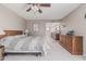 Bright, spacious bedroom featuring an ensuite bathroom and carpeted floors at 2254 E Becker Ln, Phoenix, AZ 85028