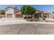 Charming stucco home with a red tile roof, mature landscaping, and a spacious three-car garage at 2254 E Becker Ln, Phoenix, AZ 85028