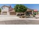 Charming home featuring a well-maintained front yard, attached garage, and stylish desert landscaping at 2254 E Becker Ln, Phoenix, AZ 85028