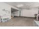 Well-lit garage providing ample space for parking and storage, plus a utility sink and garage door at 2254 E Becker Ln, Phoenix, AZ 85028