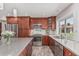 This kitchen features stainless steel appliances, custom cabinets, and a stylish backsplash at 2254 E Becker Ln, Phoenix, AZ 85028