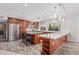 Spacious kitchen with stainless steel appliances, a central island, and breakfast bar seating at 2254 E Becker Ln, Phoenix, AZ 85028