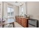 A kitchenette features a mini fridge, a sink, cabinets, and a table with seating at 2254 E Becker Ln, Phoenix, AZ 85028