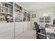 Living area features built-in bookshelves and a large window at 2254 E Becker Ln, Phoenix, AZ 85028