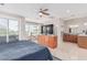 Primary bedroom with a view has built-in shelving for a television, and an ensuite bath at 2254 E Becker Ln, Phoenix, AZ 85028