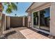 Cozy backyard patio with sliding glass door and desert landscaping at 2254 E Becker Ln, Phoenix, AZ 85028