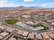 Expansive aerial view of a community featuring a scenic lake, pool, and well-maintained landscaping at 23068 E Stacey Rd, Queen Creek, AZ 85142