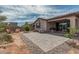 A beautiful backyard patio featuring desert landscaping with a paver patio and outdoor furniture at 23068 E Stacey Rd, Queen Creek, AZ 85142