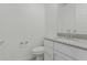 Well-lit bathroom featuring a toilet and vanity with neutral countertop at 23068 E Stacey Rd, Queen Creek, AZ 85142