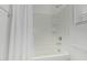 Bathroom with tub and shower featuring white tiles and chrome hardware at 23068 E Stacey Rd, Queen Creek, AZ 85142