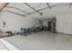 Spacious garage with speckled epoxy floors, ample storage, and room for multiple vehicles and sporting equipment at 23068 E Stacey Rd, Queen Creek, AZ 85142