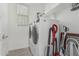 Laundry room with modern appliances and convenient shelving at 23068 E Stacey Rd, Queen Creek, AZ 85142