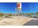 A park including a fountain and a lake at 23068 E Stacey Rd, Queen Creek, AZ 85142