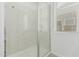Shower with glass door and chrome hardware, next to a window at 23068 E Stacey Rd, Queen Creek, AZ 85142