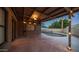 Relaxing covered patio with string lights overlooking the sparkling private pool at 2337 E Riviera Dr, Tempe, AZ 85282