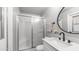 Cozy bathroom with glass-enclosed shower and modern vanity with black faucet at 2337 E Riviera Dr, Tempe, AZ 85282