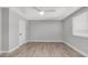 Bedroom featuring ceiling fan, neutral walls, and light-colored, wood-look flooring at 2337 E Riviera Dr, Tempe, AZ 85282