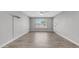 Bright, unfurnished bedroom featuring wood-look floors and a ceiling fan at 2337 E Riviera Dr, Tempe, AZ 85282