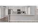 Bright, airy kitchen featuring white cabinets, stainless steel appliances, and a stylish breakfast bar at 2337 E Riviera Dr, Tempe, AZ 85282