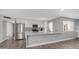 Bright, airy kitchen featuring white cabinets, stainless steel appliances, and a stylish breakfast bar at 2337 E Riviera Dr, Tempe, AZ 85282