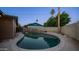 Enjoy evenings in the private backyard featuring a sparkling pool and ambient string lights at 2337 E Riviera Dr, Tempe, AZ 85282