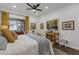 Bright bedroom with patterned curtains and a cozy bed at 23705 S Pleasant Way, Sun Lakes, AZ 85248