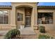 Charming home featuring a welcoming front entrance with an arched doorway, providing curb appeal at 23705 S Pleasant Way, Sun Lakes, AZ 85248