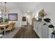 Open hallway showcases stylish art, neutral walls, and an open floorplan at 23705 S Pleasant Way, Sun Lakes, AZ 85248