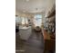 Bright eat-in kitchen offers white cabinetry, light countertops, and a dining area with great natural light at 23705 S Pleasant Way, Sun Lakes, AZ 85248