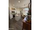 Modern kitchen with white cabinets, stainless steel appliances, and a quartz island for meal preparation at 23705 S Pleasant Way, Sun Lakes, AZ 85248
