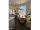 Bright kitchen featuring a charming breakfast nook with a large window, creating a cozy dining space at 23705 S Pleasant Way, Sun Lakes, AZ 85248