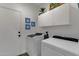 Functional laundry room with ample cabinet storage at 23705 S Pleasant Way, Sun Lakes, AZ 85248