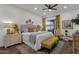 Relaxing main bedroom with neutral walls, a ceiling fan, and soft lighting for a serene atmosphere at 23705 S Pleasant Way, Sun Lakes, AZ 85248