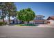 Charming two story home featuring a well-manicured lawn in a suburban neighborhood at 2424 E Ivy St, Mesa, AZ 85213