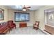 Cozy living room with classic furniture, neutral walls, ceiling fan and soft carpeting creating a relaxing ambiance at 2424 E Ivy St, Mesa, AZ 85213