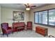 Cozy living room featuring classic furniture, neutral walls, ceiling fan, and carpet providing a cozy feel at 2424 E Ivy St, Mesa, AZ 85213