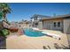 An outdoor oasis showcasing a sparkling pool with a diving board, perfect for enjoying sunny days at 2424 E Ivy St, Mesa, AZ 85213