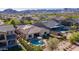 Picture of a house featuring a pool, putting green, hot tub, and mountain views at 2701 N Black Rock Rd, Buckeye, AZ 85396