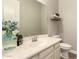 Bathroom featuring a white sink and vanity, a decorative plant, and a toilet at 2701 N Black Rock Rd, Buckeye, AZ 85396