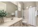 Bathroom features a shower, bathtub, vanity, and decorative flower arrangement at 2701 N Black Rock Rd, Buckeye, AZ 85396