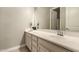 Bathroom view features vanity, mirror, decorative features, and natural light at 2701 N Black Rock Rd, Buckeye, AZ 85396