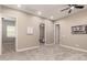 Cozy bedroom features plush carpeting, recessed lighting, and neutral paint tones at 2701 N Black Rock Rd, Buckeye, AZ 85396