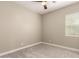 Empty bedroom features plush carpet, neutral walls, and a bright window at 2701 N Black Rock Rd, Buckeye, AZ 85396