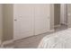 Bedroom closet has neutral paint tones and plush carpet, adjacent to the bed at 2701 N Black Rock Rd, Buckeye, AZ 85396