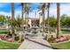 Community center with a water fountain in a landscaped common area with palm trees at 2701 N Black Rock Rd, Buckeye, AZ 85396