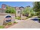 Community entrance with manicured landscaping, decorative signage, and well-maintained sidewalks at 2701 N Black Rock Rd, Buckeye, AZ 85396