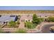 Charming home featuring a well-manicured front yard and a three-car garage at 2701 N Black Rock Rd, Buckeye, AZ 85396