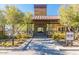 Inviting fireplace in a covered outdoor area, surrounded by lush greenery and comfortable seating at 2701 N Black Rock Rd, Buckeye, AZ 85396