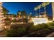 Verado Golf Club boasts inviting signage and landscaping, lit with decorative string lights at night at 2701 N Black Rock Rd, Buckeye, AZ 85396