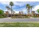 Stately entrance to Verrado Golf Club with manicured landscaping, mature trees, and Spanish architecture at 2701 N Black Rock Rd, Buckeye, AZ 85396